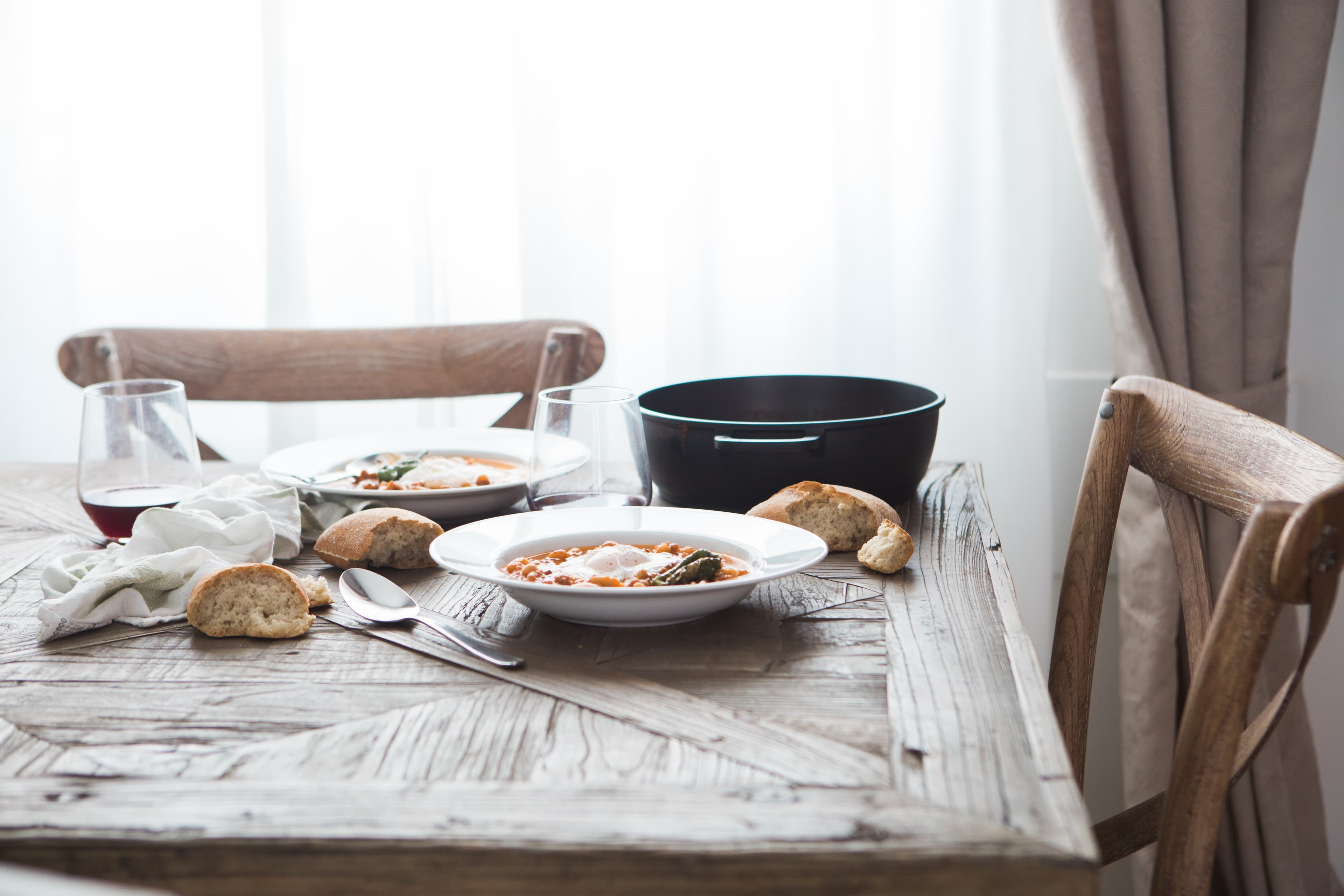 Empty dinner table with delicious soup